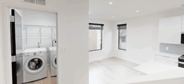 Laundry room with washer and dryer in modern apartment.