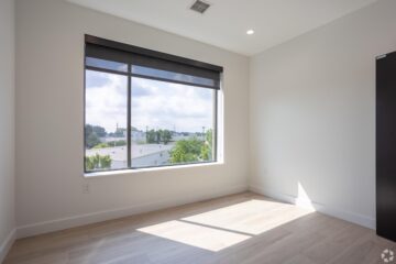 Person in surgical mask and cap in medical setting
