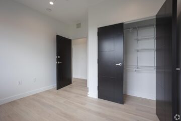 Golden retriever dog sitting on grassy field outdoors