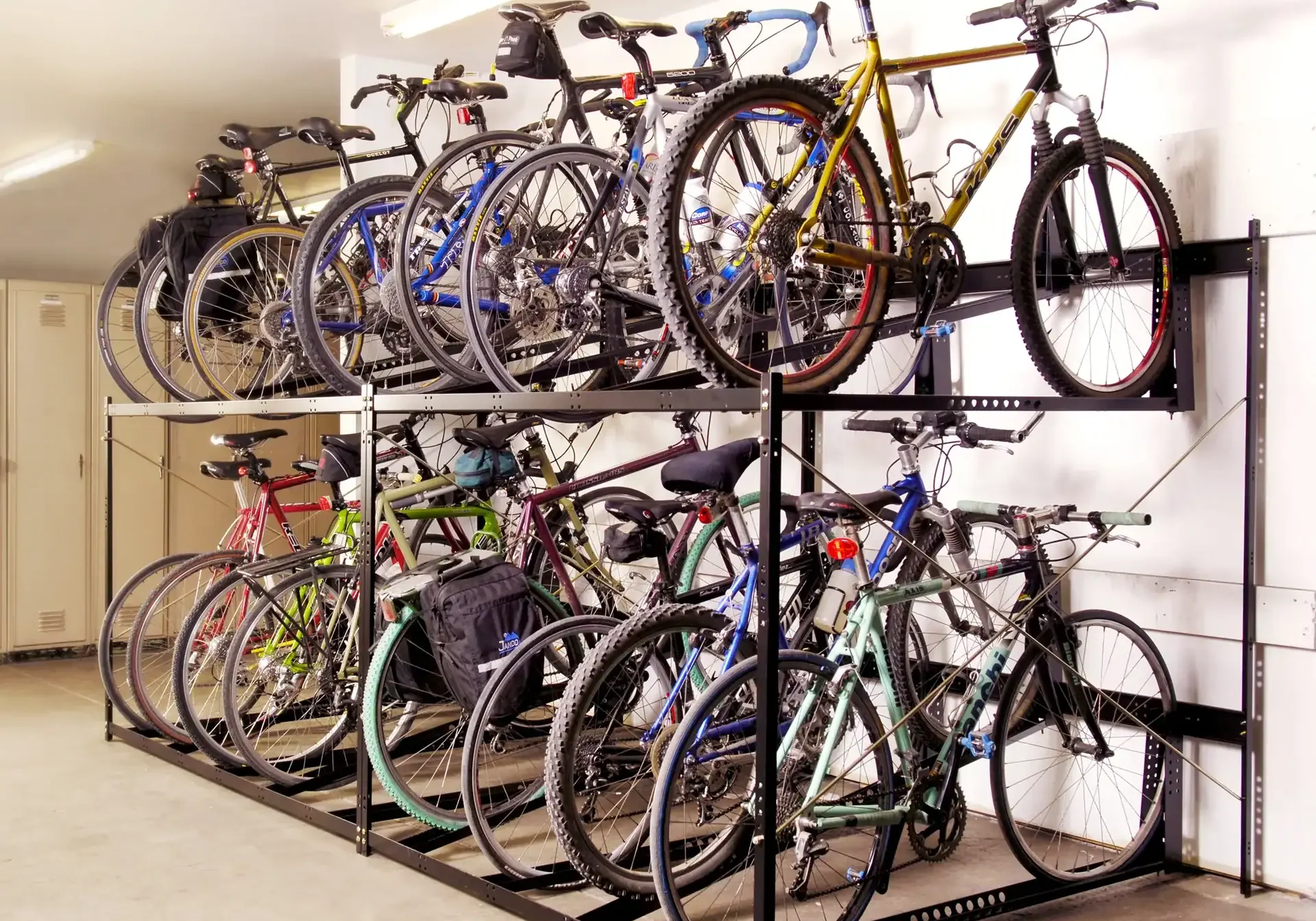 Bicycle parking rack with multiple bikes stored on two levels at The 616.