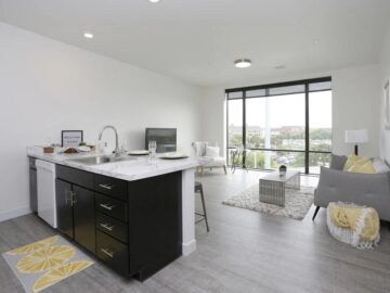 Modern open-concept apartment with kitchen island and living area